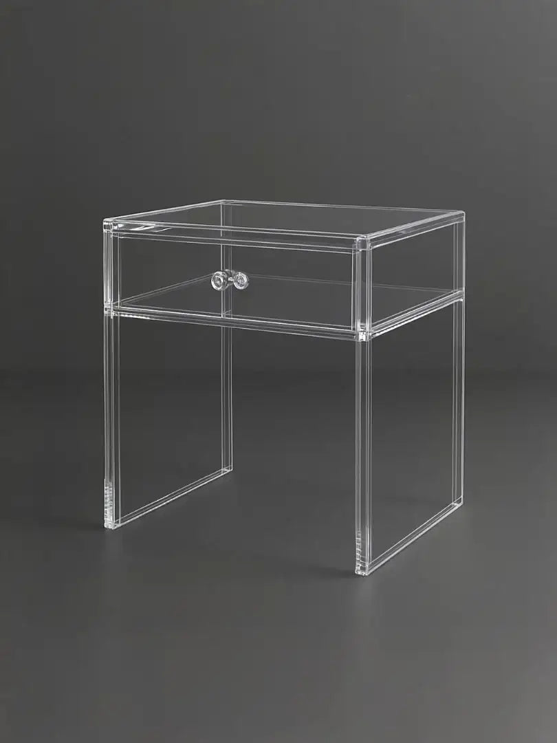 Modern clear acrylic furniture featuring a minimalist nightstand with a single drawer.