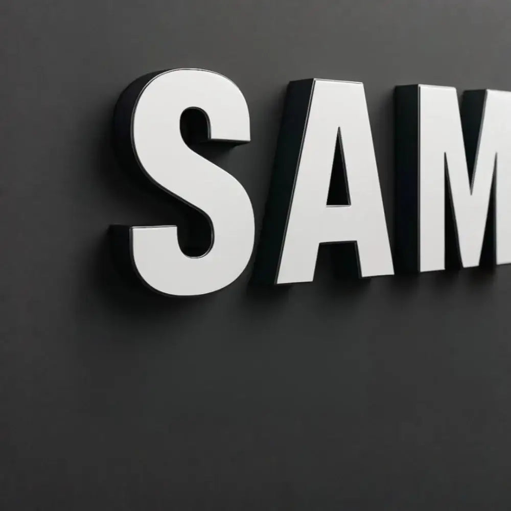 Custom 3D acrylic letters mounted on a dark matte wall for commercial signage.