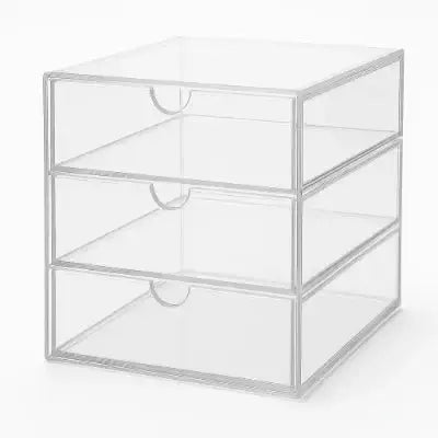 Clear acrylic drawer organizer with three accessible compartments for neat storage.
