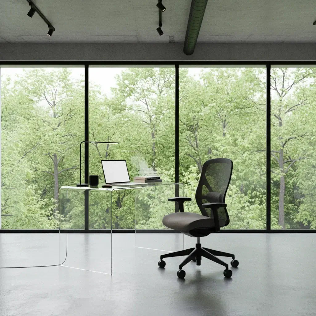 Modern Clear Acrylic Waterfall Desk with workspace and ergonomic chair in airy office setting.