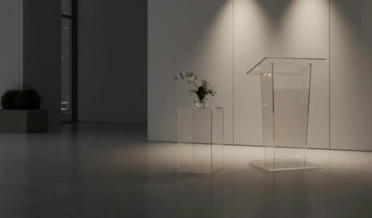 Clear custom acrylic pedestal displays in a minimalist modern interior setting.